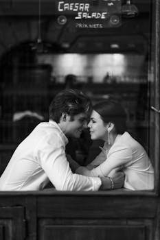 Romantic Couple in Black and White Café Setting